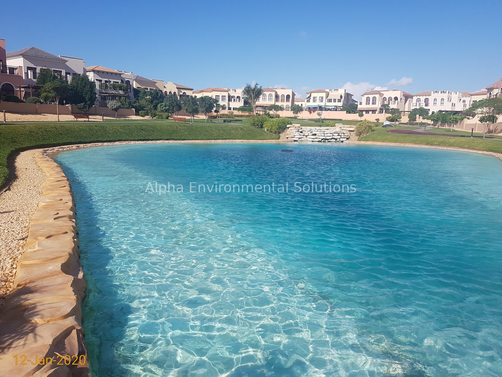 The same UAE community lake with clear water after Alpha's annual lake management plan